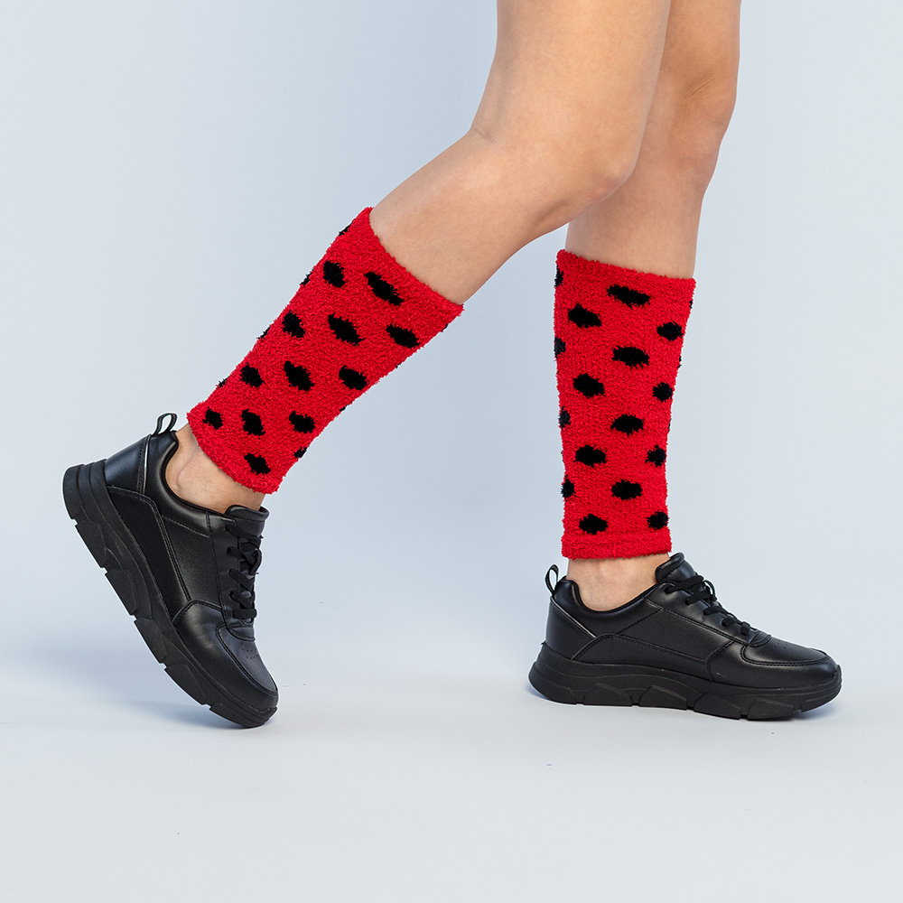 Paar beenwarmers Lieveheersbeestje